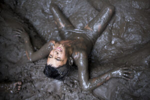 Julian exhausted during a mud fight. Last boy camp of the Gymnasium School.